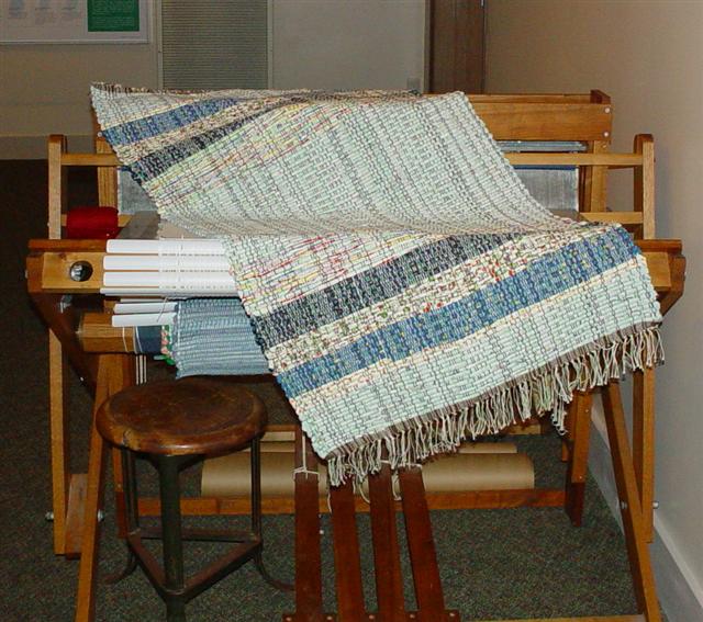 Rag rug laying across the PP Loom