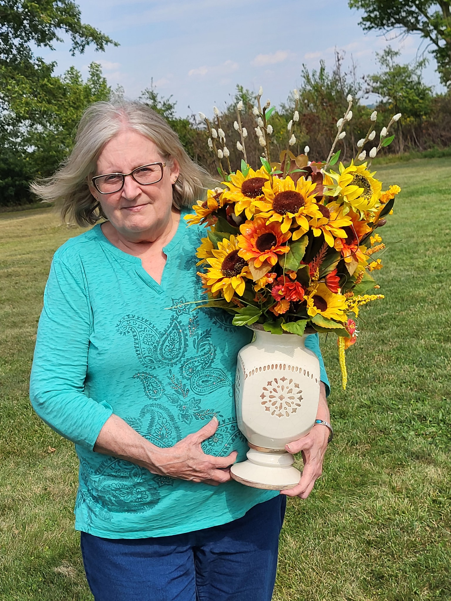 Ginny Stevens won second placeFall Flower Arrangement.